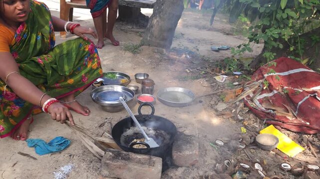 Rural Indian Woman Cooking Outdoors in Traditional Village Kitchen, Preparing Food on Wood Fire Chulha, Authentic Indian Lifestyle, Culture and Rural Life