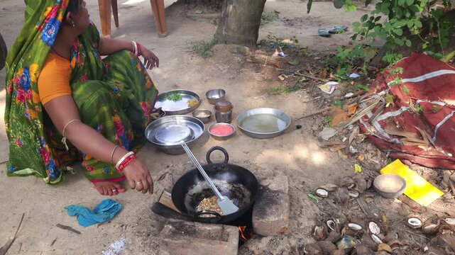 Rural Indian Woman Cooking Outdoors in Traditional Village Kitchen, Preparing Food on Wood Fire Chulha, Authentic Indian Lifestyle, Culture and Rural Life