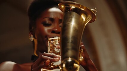 A woman passionately plays a golden saxophone, focused on the music Stock Video
