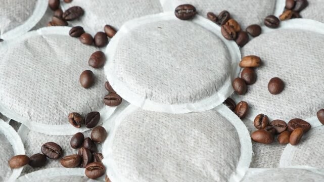 Macro Close-up of Round Paper Coffee Pods for Single-Serve Coffee Machine.
