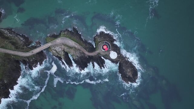 Aerial view of the Petit Minou lighthouse stands at the edge of a rocky islet, connected by a narrow causeway, Bretagne, France.