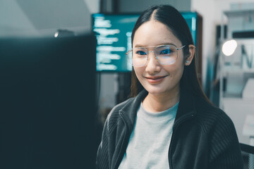 The confident programmer in a modern workspace with coding displays. Software management, inspection, data or troubleshooting at night