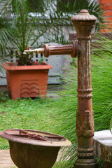 Rusty outdoor water tap in the garden
