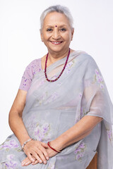 Portrait of beautiful senior woman on white background