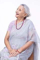 Portrait of cheerful aged Indian senior woman.