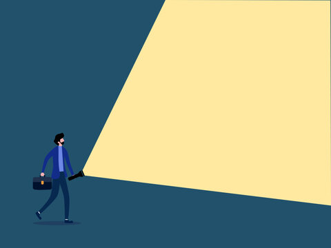businessman shines a flashlight for advertising purposes