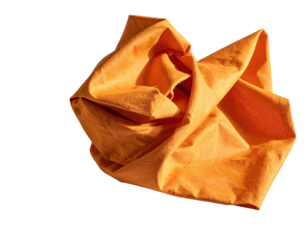 A crumpled, vibrant orange cloth against a stark black background, illuminated by sunlight
