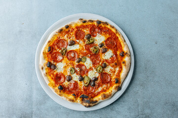 Fresh artisan Salami pizza with olives