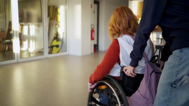 Teen student in wheelchair in inclusive school setting.