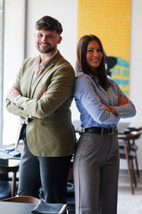 Obraz premium Two professionals pose confidently in a modern dining space during a business meeting in an urban location