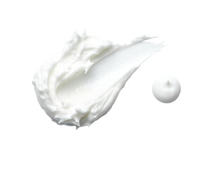A close-up shot of a white cream swipe and a small dollop, isolated on black