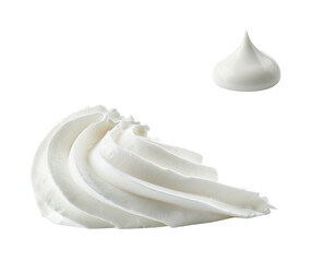 Close-up of two white, whipped dairy cream dollops against a black background