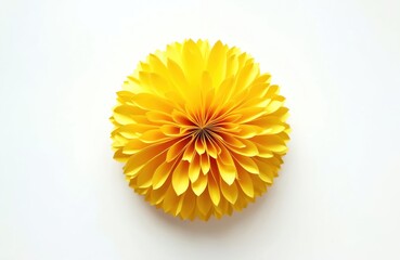 Bright yellow paper flower pompom decoration. Hand made round ornament isolated on white background. Used for party, birthday, festival celebrations, craft projects, and event decor.