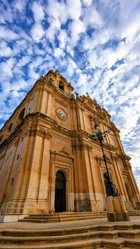 Imposing Facade of St. Helen's Basilica Under a Blue Sky, Malta