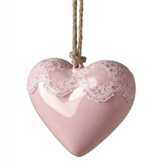 Pink heart, lace adorned, hangs by a twine loop