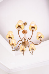 Elegant Multi-Arm Chandelier Hanging from White Ceiling