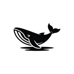 Obraz premium A striking black silhouette of a whale breaching the water s surface