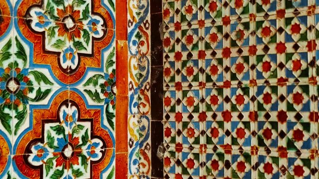A row of zelliges or Andalusian tiles, known for their intricate geometric patterns and vibrant, hand-cut pieces with eight-pointed star motifs seen in Moorish architecture