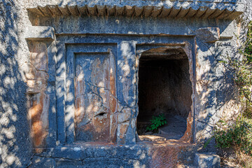The ancient Lycian rock tombs of Demre (Myra) are carved into the red cliffs: facades with Doric columns and pilasters over terraces, a classic symbol of Lycian culture in Turkey. 