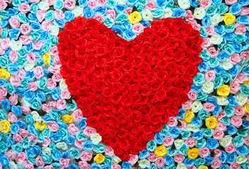A red heart made of fabric roses