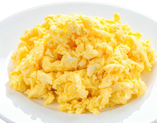Close-up of fluffy scrambled eggs on a white plate, ready to be eaten