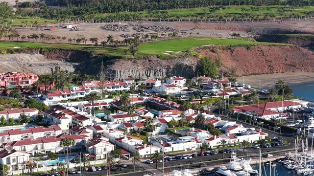 Aerial of Meloneras Golf Course and Pasito Blanco Private Marina, Featuring Luxury Yacht Berths and Frontline Villa Estates, Gran Canaria, Spain