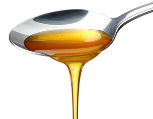 Close-up of spoon holding golden, viscous liquid, dripping against black