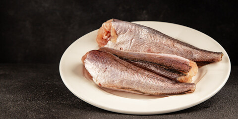 Hake raw fish seafood healthy food main course ingredient appetizer fresh delicious gourmet food table setting rustic food top view copy space pescatarian diet