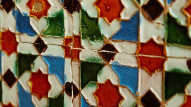 A row of zelliges or Andalusian tiles, known for their intricate geometric patterns and vibrant, hand-cut pieces with eight-pointed star motifs seen in Moorish architecture