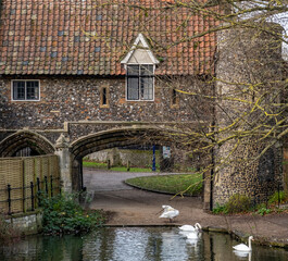 The historic Pulls Ferry on the River Wensum in the city of Norwich, Norfolk