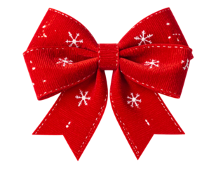 A festive, red ribbon bow with white snowflake designs, isolated on a black background