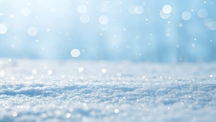 Soft snowfall sparkles gently in a serene winter landscape with blurred blue background.