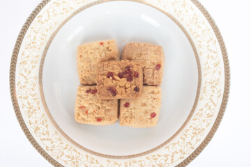 Cookies arranged on an ornate gold-trimmed plate