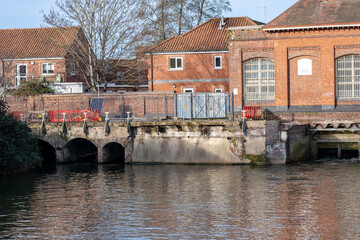 The Victorian era New Mills Sluice on the River Wensum in the city of Norwich