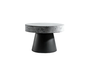 A modern, minimalist side table with a concrete top and dark, flared base, isolated on black
