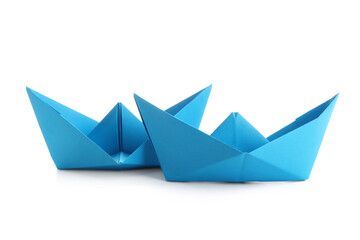 Blue paper boats on white background
