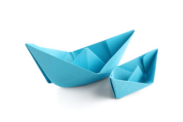 Blue paper boats on white background
