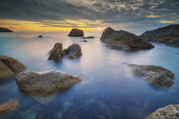Beautiful seascape. Sea and stones on sunset.