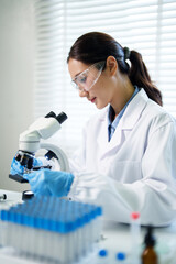 Asian adult scientist research lab microscope experiment biology medical discovery pharmaceutical healthcare innovation precision study analysis scientific development