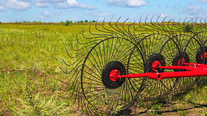 Agricultural Hay Rake Machinery Equipment. Field Side View Red Color