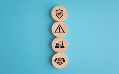 Wooden blocks with security and trust icons on blue background