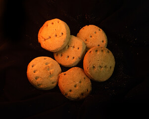Group Of Round Shortbread Cookies On Dark Background.