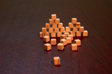 Wooden Cube Blocks Stacked on Dark Table for Learning, Creativity, and Play
