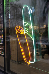 Neon fast food sign in window