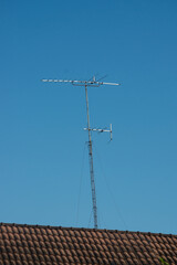 TV antenna on roof of house