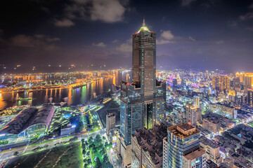 Obraz premium Aerial view of Kaohsiung 85 Sky Tower and Kaohsiung Harbor at sunset, Taiwan cityscape.