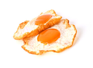 two Fried egg , Fried sunny side up egg stacked on top of each other isolated on white background .