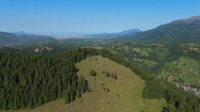 Cinematic Aerial 180 Panorama of Moieciu de Sus and Fundata Hills revealing Bucegi Mountains Ridge in Transylvania Romania Scenic Landscape