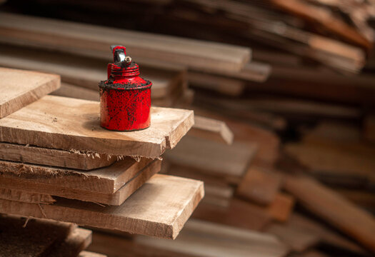 Oil Can Rusty On a Timber Plank