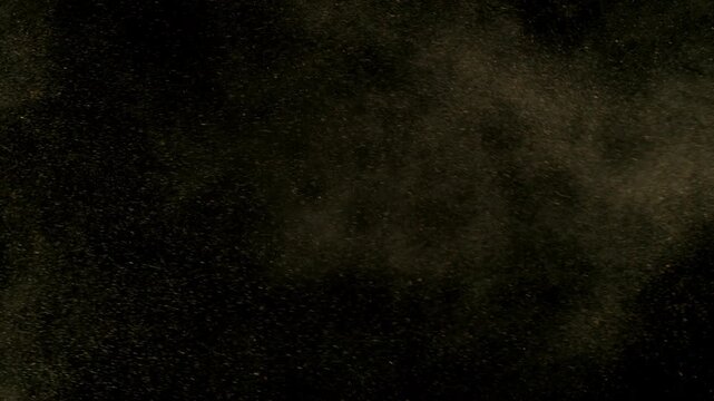 Super Slow Motion Shot of Flying Sand Powder , Isolated on Black Background , Filmed on High Speed Cinematic Camera at 1000 FPS